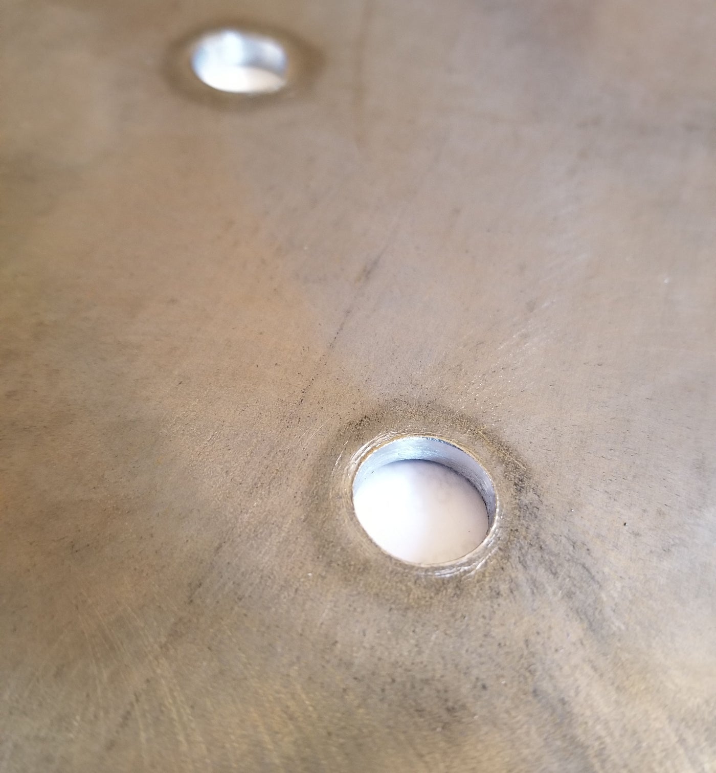 close up of our steel brackets cleanly drilled holes; 